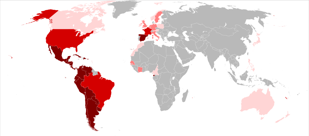 Auf dem Bild ist eine Welt·karte. Dort wo Spanisch gesprochen wird, ist eine rote Farbe zu sehen.